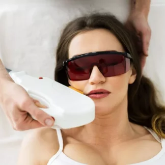 A woman getting her face laser hair removal.