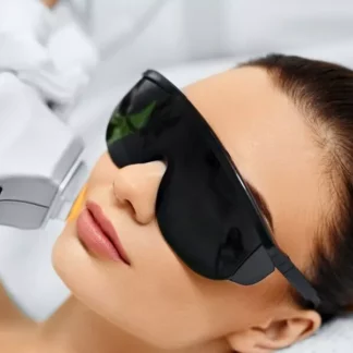 A woman with sunglasses on laying down