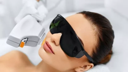 A woman with sunglasses on laying down